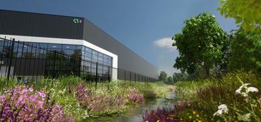 Rendering of the corner of a warehouse with a river and greenery infront