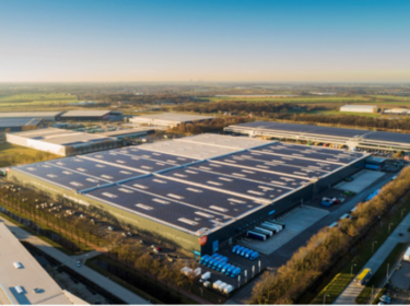 View from above on a warehouse with solar panels on the roof