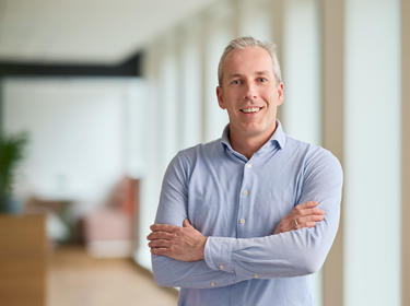 Arthur van Kooij standing in an office