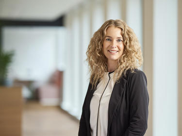 Jessica Pilkes standing in an office