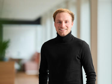 Miel Aerts-web.jpg Miel Aerts standing in an office