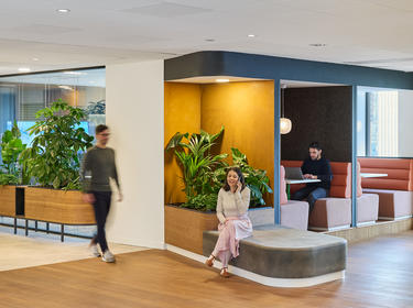 Prologis employees working and moving through the office