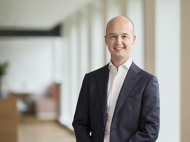 Robin Tiktak.jpg Robin Tiktak standing in an office