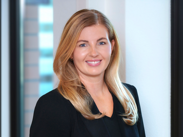 Gina Helmond standing in an office