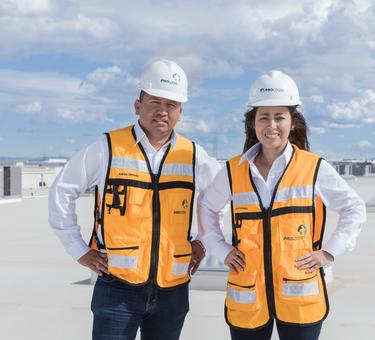 Two Prologis employees stand on the roof of Centro Industrial distribution center in Juarez, Mexico