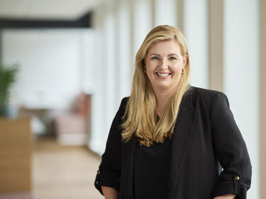 Gina Helmond standing in an office Gina Helmond standing in an office